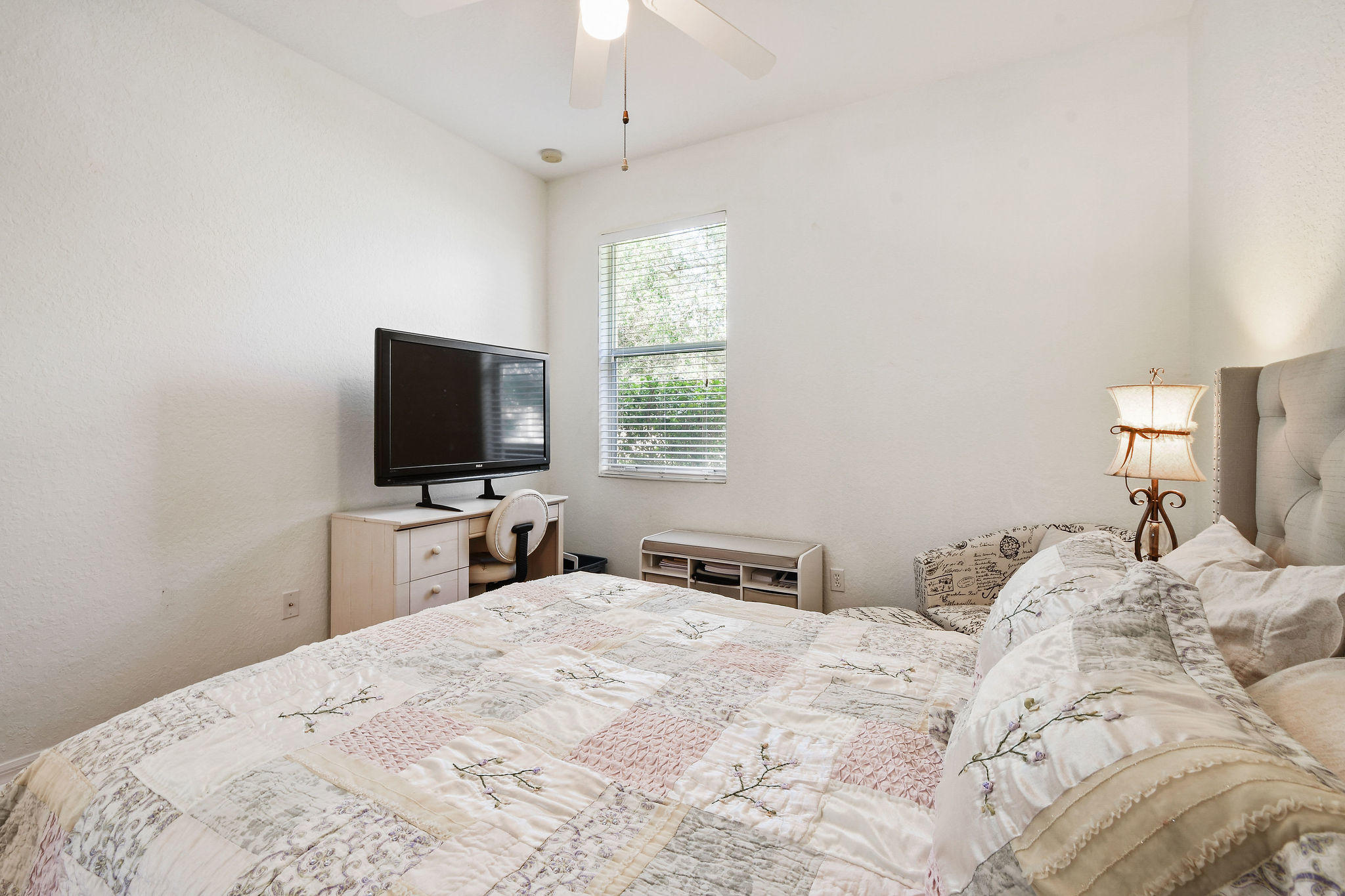 4100 Silverstone Drive Fort Pierce, FL 34947 - Photo 35 of 42 a bedroom with a bed and a flat screen tv
