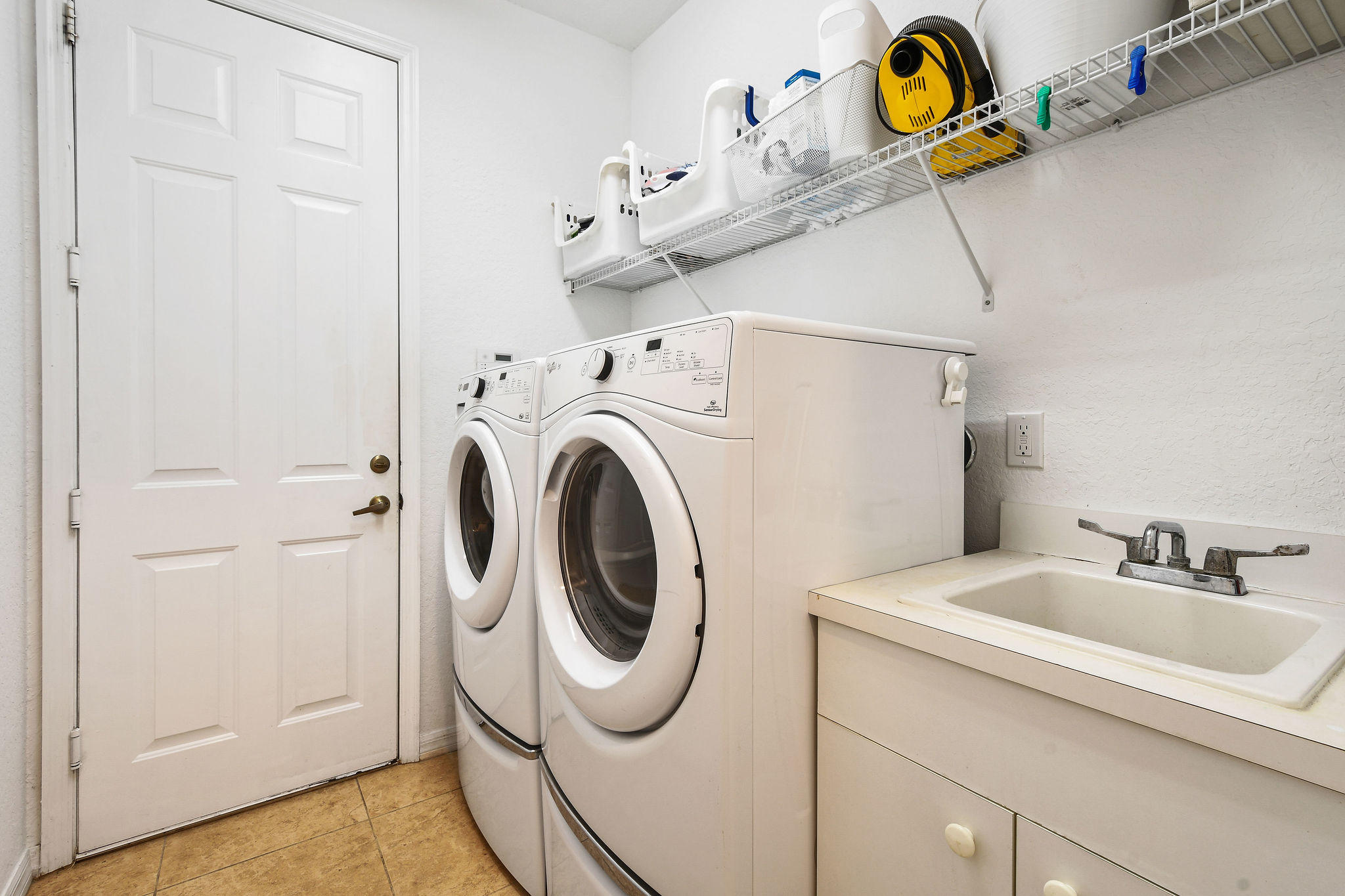4100 Silverstone Drive Fort Pierce, FL 34947 - Photo 38 of 42 a utility room with dryer and washer