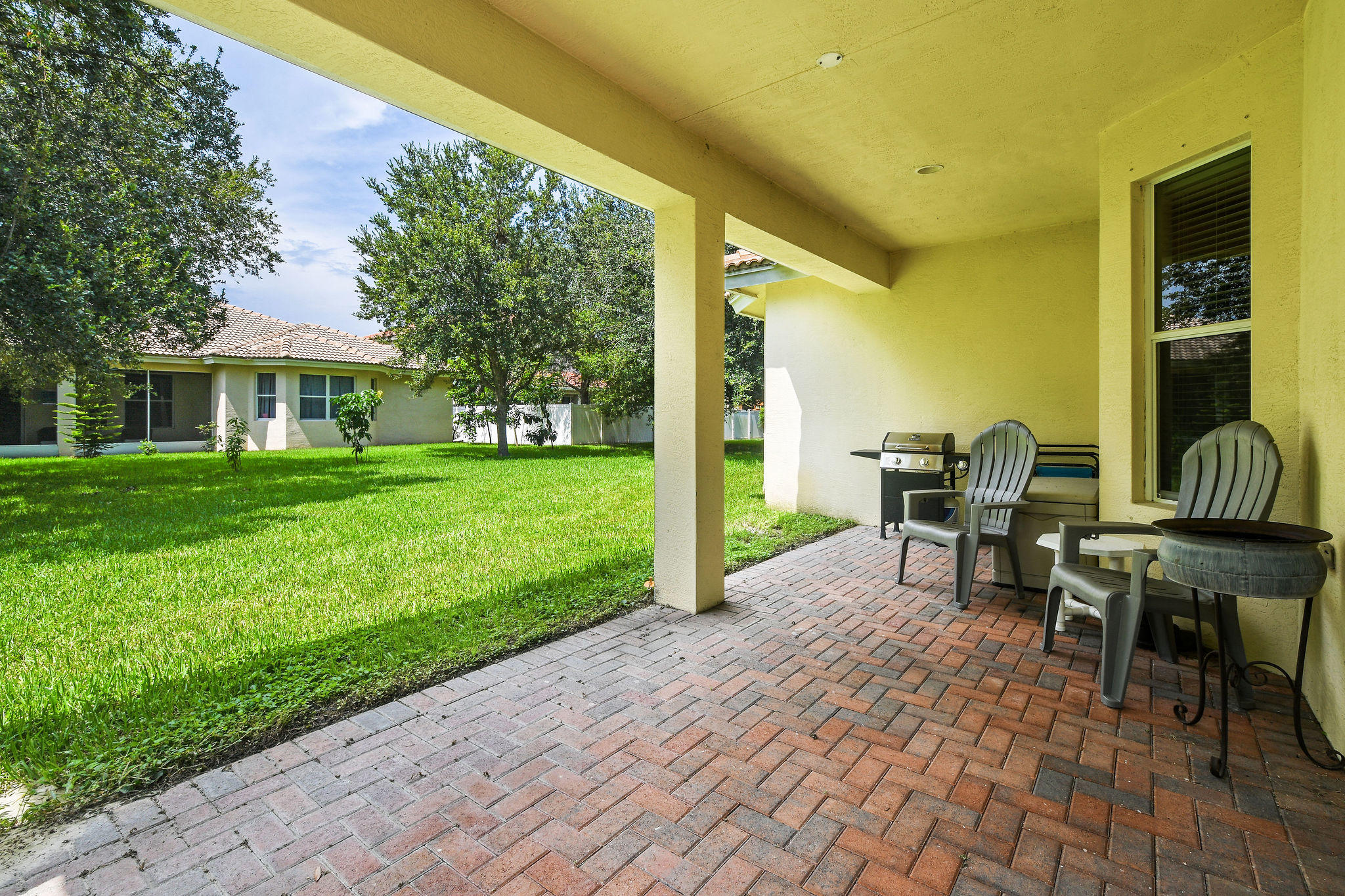 4100 Silverstone Drive Fort Pierce, FL 34947 - Photo 39 of 42 a view of a house with backyard sitting area and garden