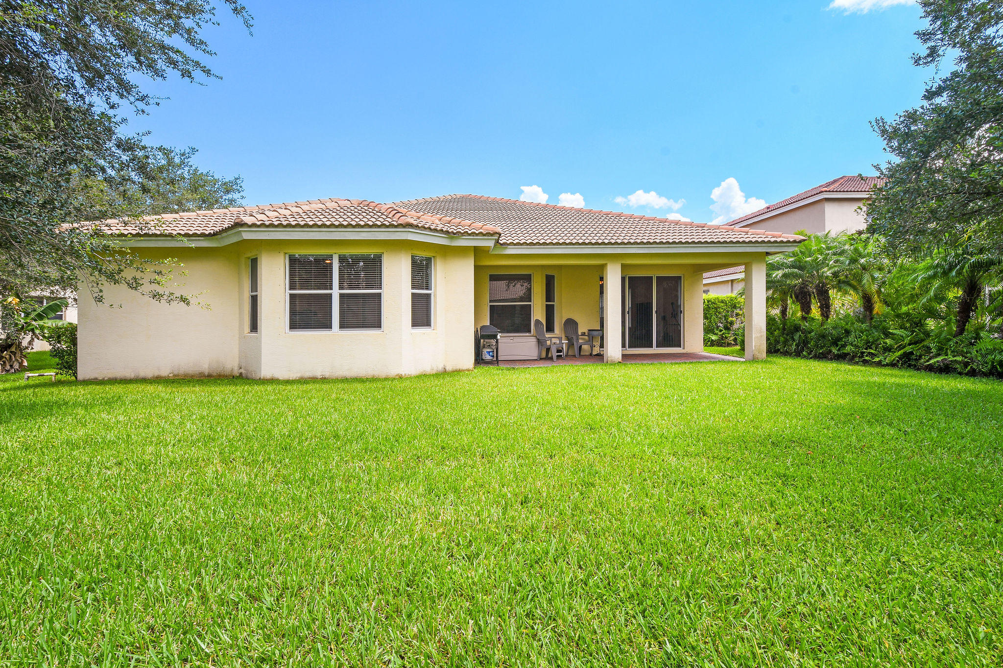 4100 Silverstone Drive Fort Pierce, FL 34947 - Photo 40 of 42 a view of a house with yard and tree s