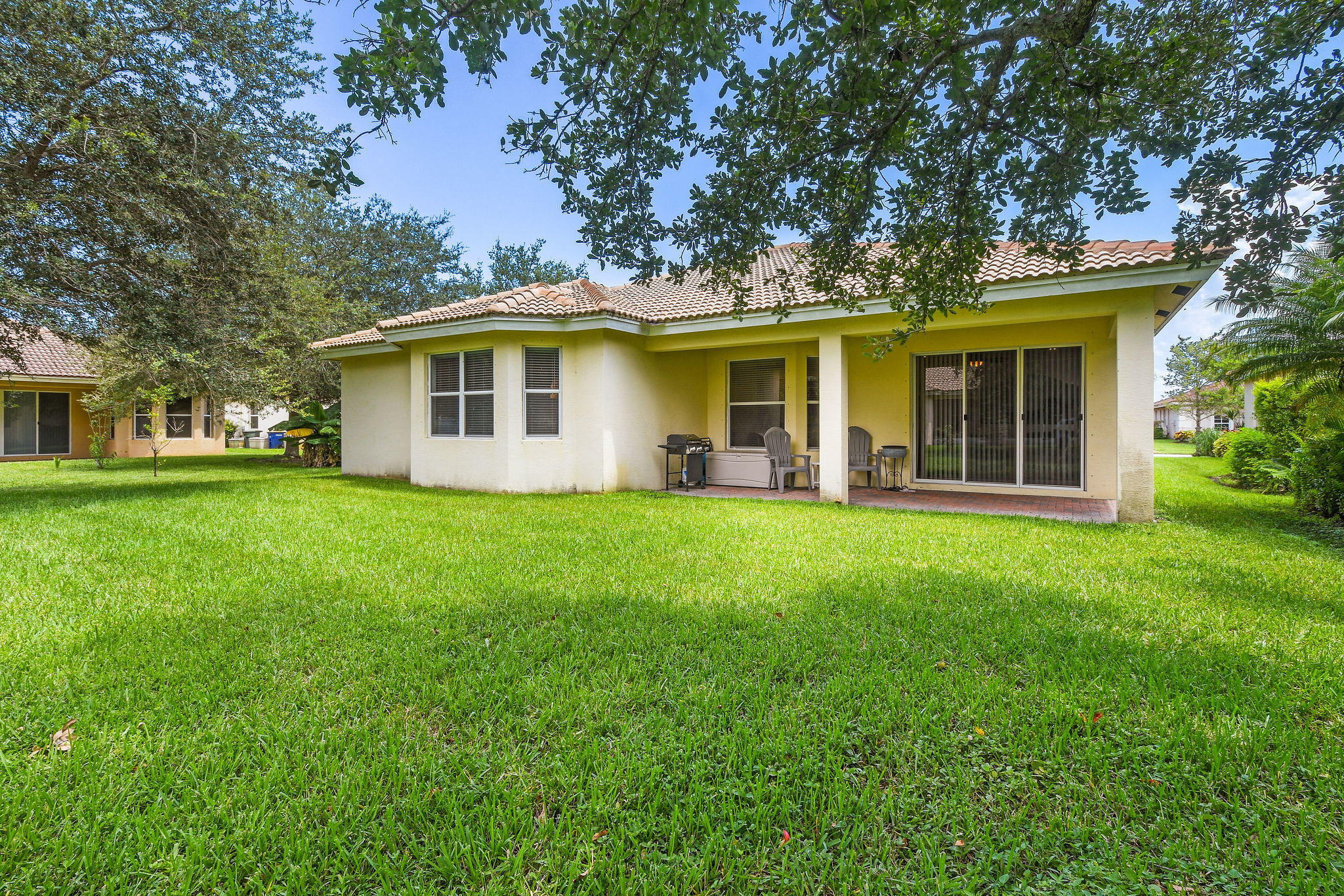 4100 Silverstone Drive Fort Pierce, FL 34947 - Photo 41 of 42 a front view of house with yard and green space