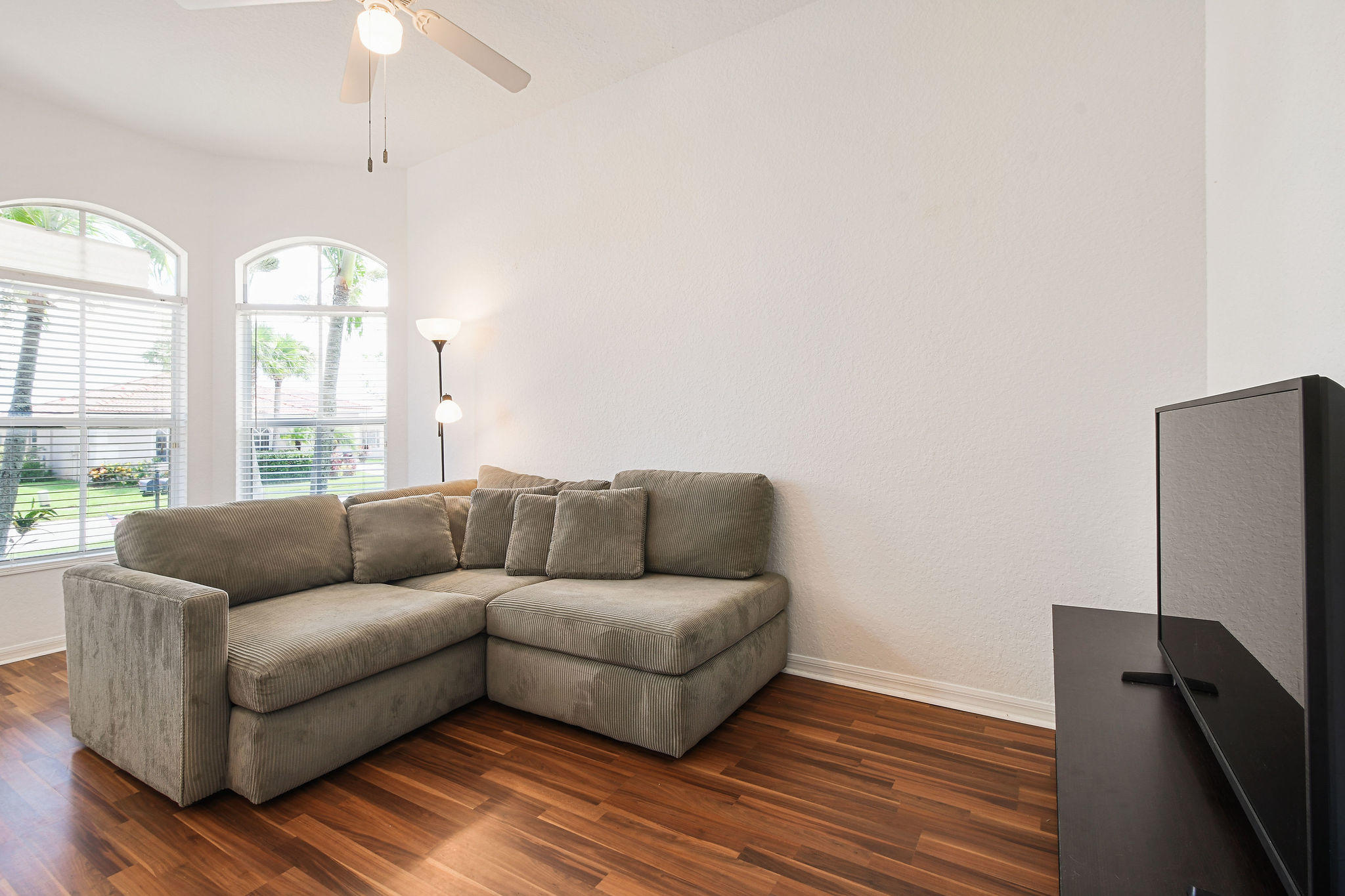 4100 Silverstone Drive Fort Pierce, FL 34947 - Photo 7 of 42 a living room with furniture and a large window