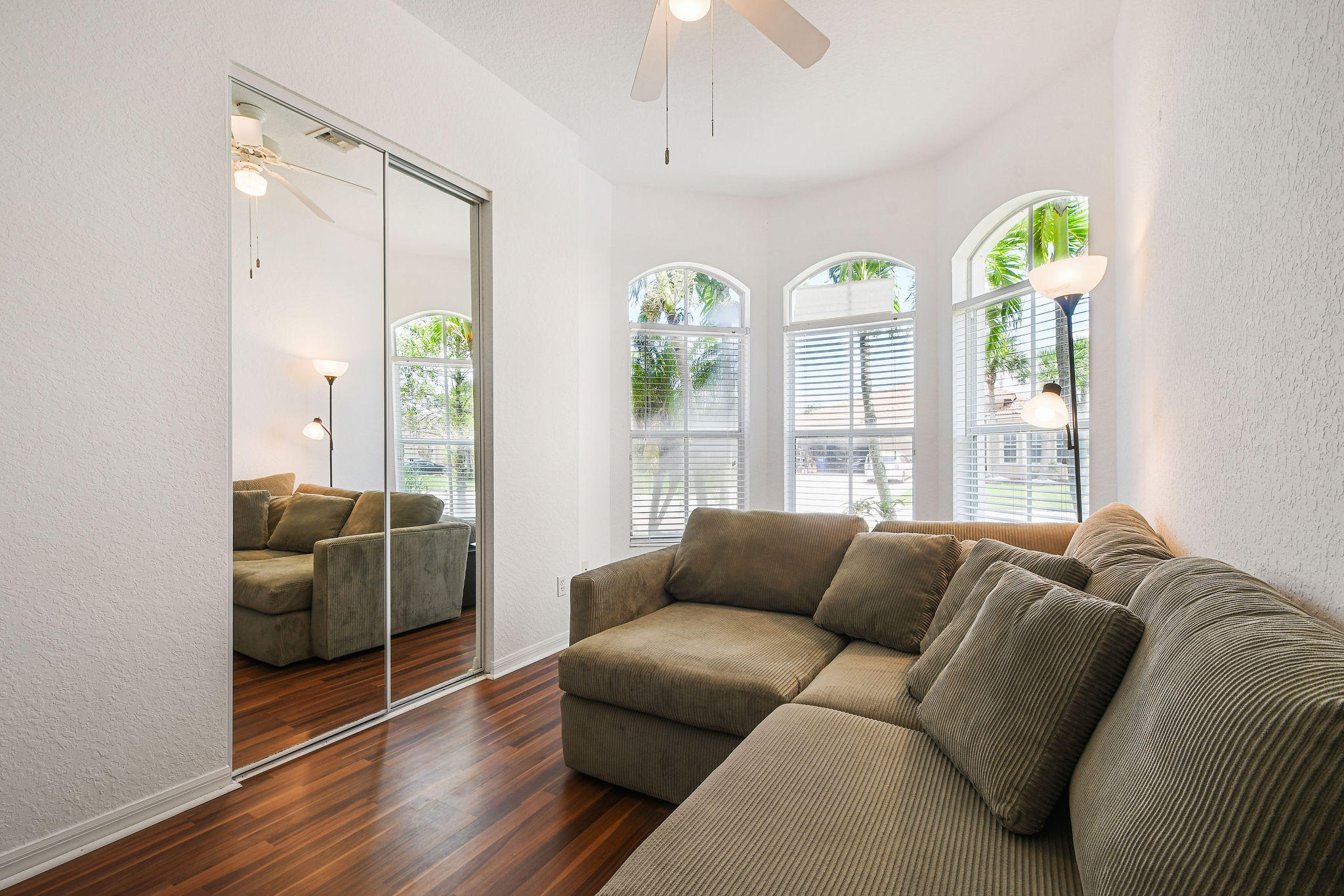 4100 Silverstone Drive Fort Pierce, FL 34947 - Photo 8 of 42 a living room with furniture and a wooden floor