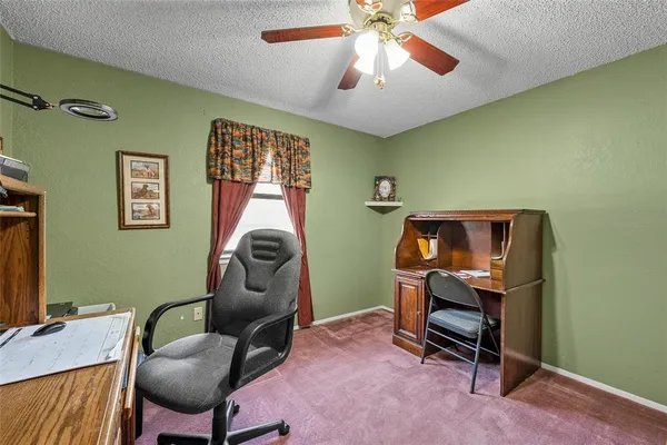 a view of a workspace with furniture