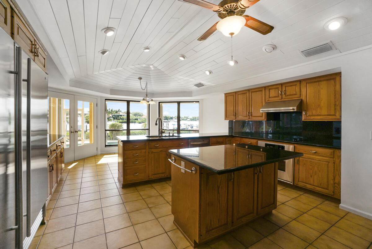 19842 Wilkinson Leas Road Jupiter, FL 33469 - Photo 27 of 75 a large kitchen with stainless steel appliances granite countertop a sink and counter space