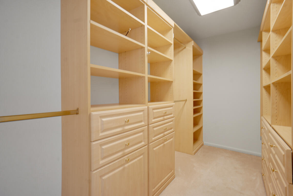 19842 Wilkinson Leas Road Jupiter, FL 33469 - Photo 40 of 75 a view of walk in closet with empty racks
