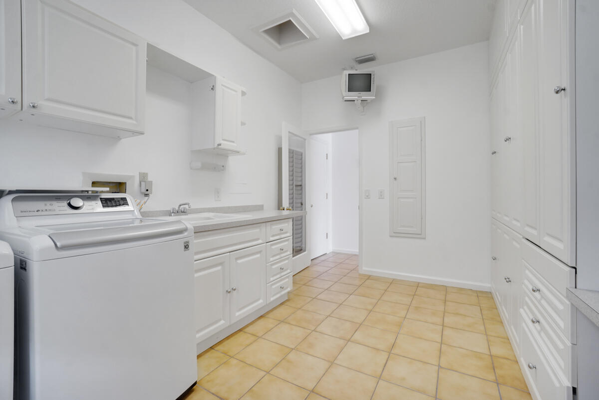 19842 Wilkinson Leas Road Jupiter, FL 33469 - Photo 44 of 75 a view of kitchen with white cabinets and white appliances