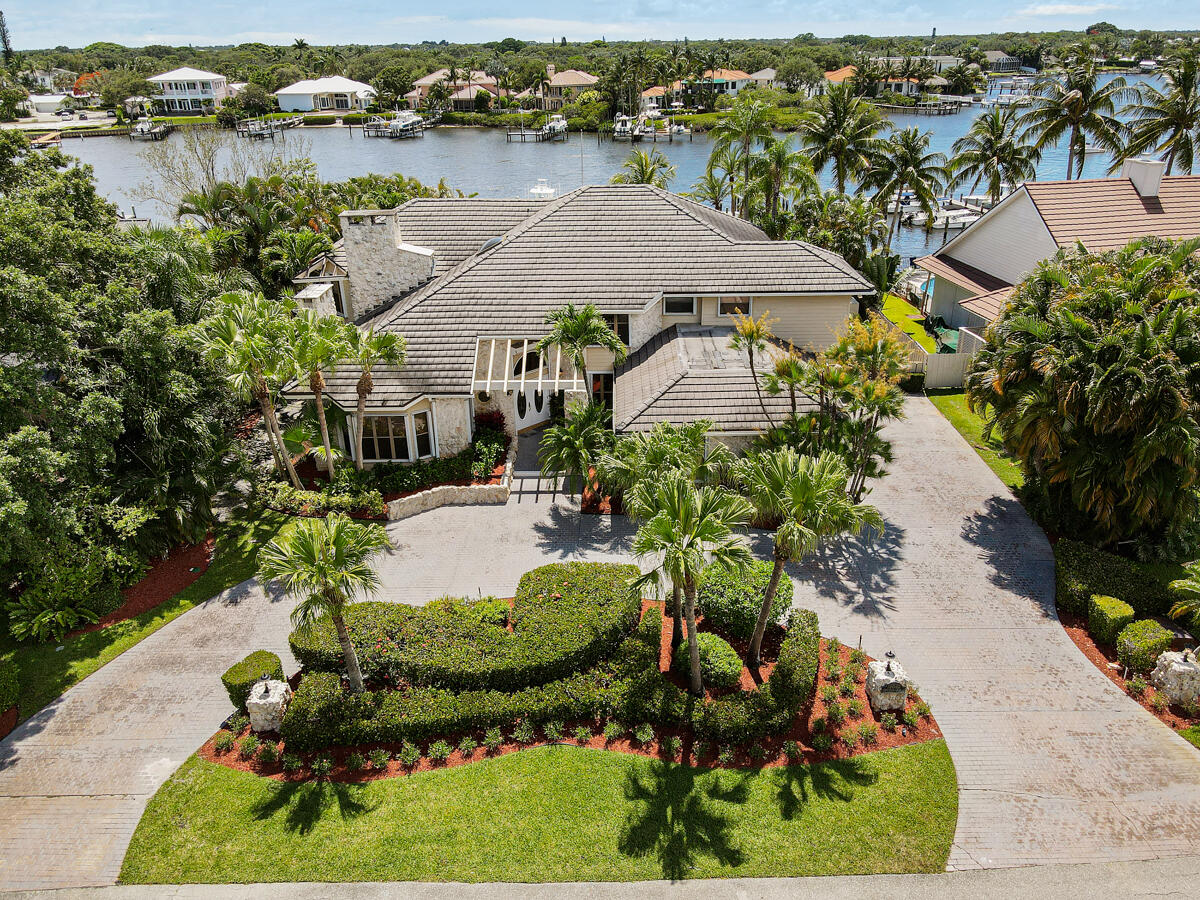 19842 Wilkinson Leas Road Jupiter, FL 33469 - Photo 6 of 75 an aerial view of a house with garden space and lake view