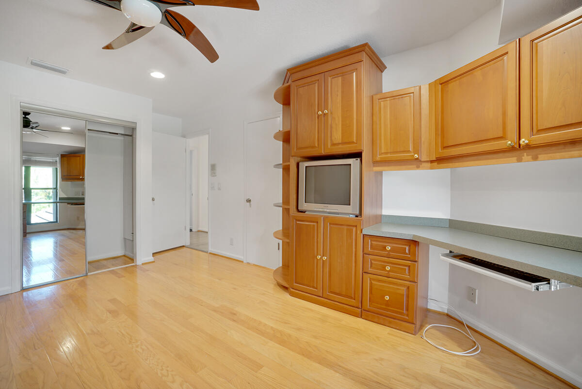 19842 Wilkinson Leas Road Jupiter, FL 33469 - Photo 64 of 75 a kitchen with stainless steel appliances granite countertop a sink and cabinets