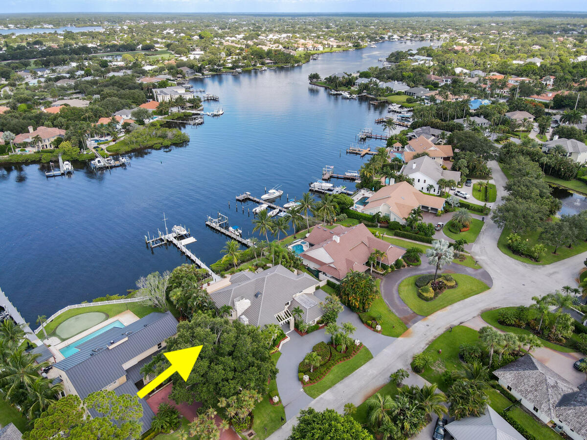 19842 Wilkinson Leas Road Jupiter, FL 33469 - Photo 66 of 75 an aerial view of a house with a lake view