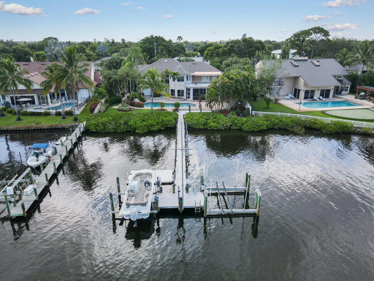 19842 Wilkinson Leas Road Jupiter, FL 33469 - Photo 69 of 75 an aerial view of a house with outdoor space and lake view