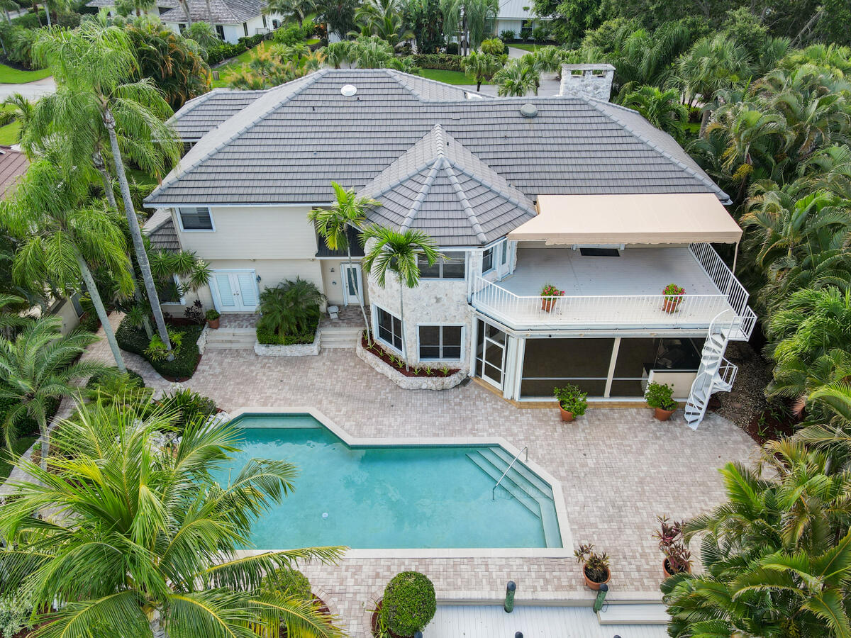 19842 Wilkinson Leas Road Jupiter, FL 33469 - Photo 72 of 75 an aerial view of a house with a yard patio and fire pit