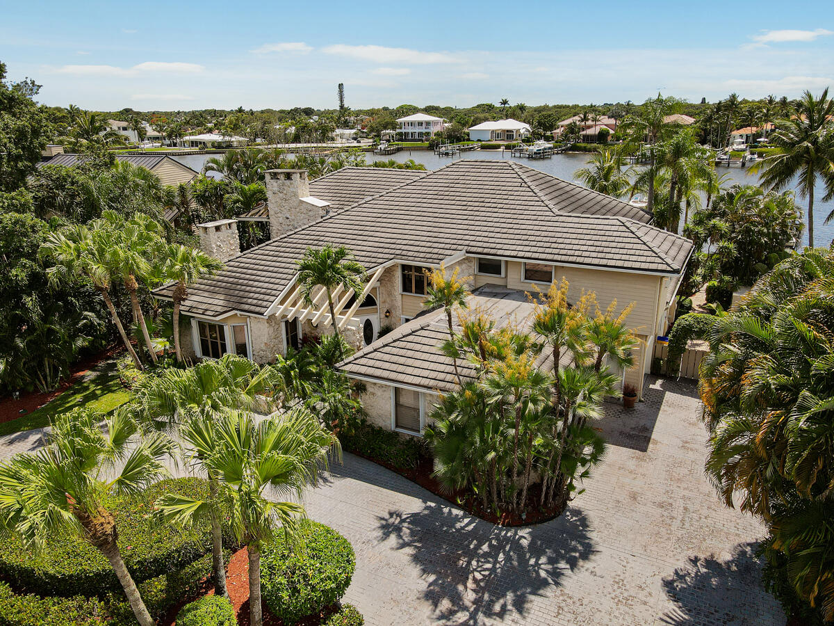 19842 Wilkinson Leas Road Jupiter, FL 33469 - Photo 8 of 75 a aerial view of a house with a yard and garden