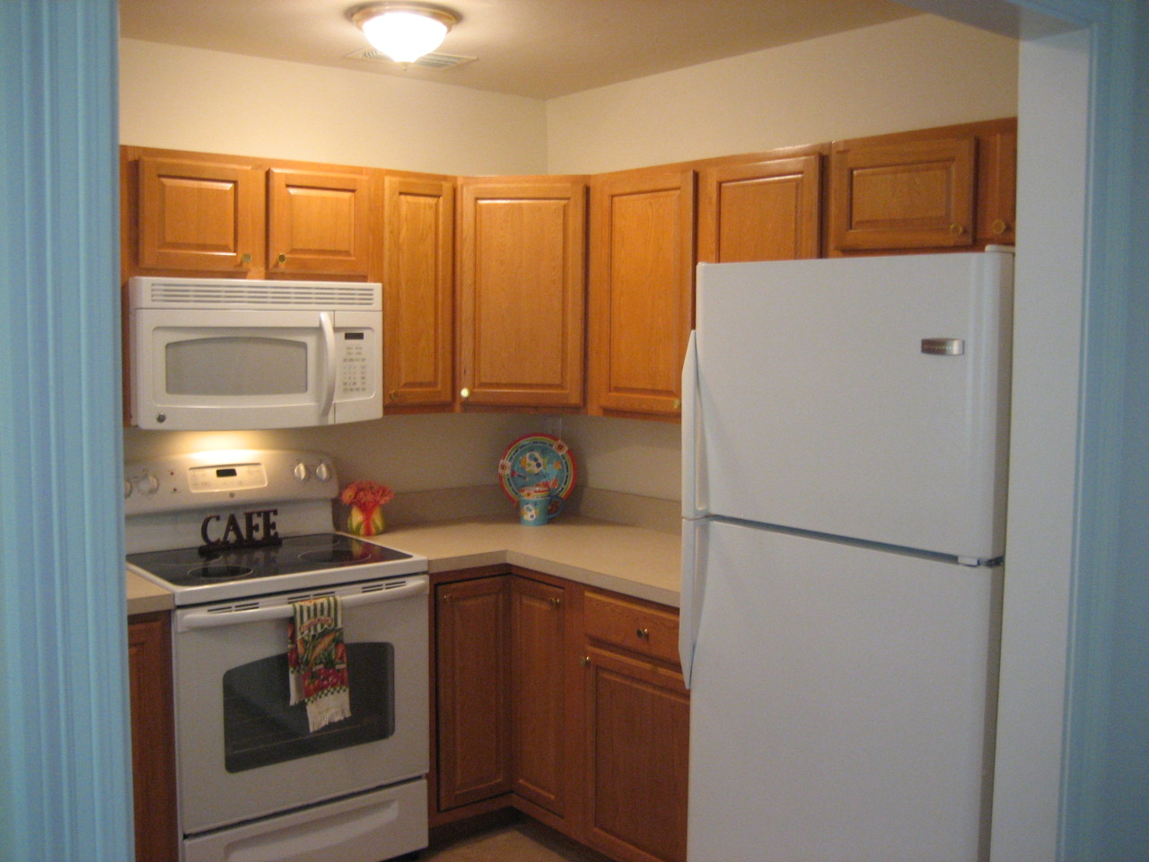 6943 Rollo Road Jacksonville, FL 32205 - Photo 6 of 13 a kitchen with a refrigerator sink and stove top oven