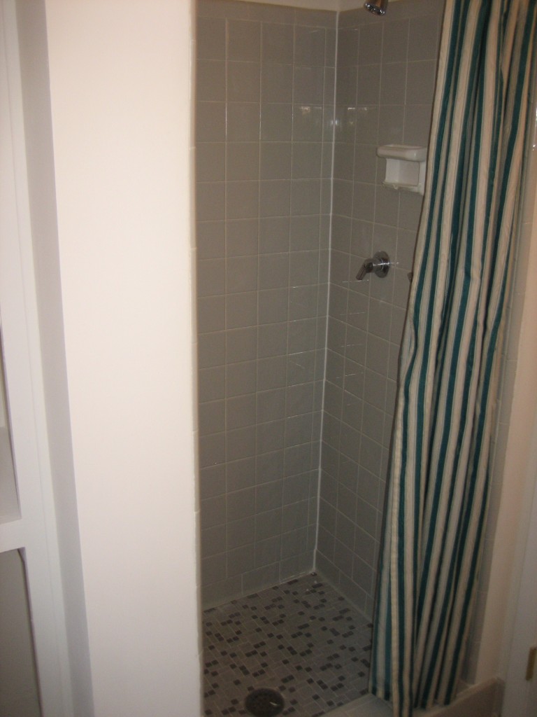 6943 Rollo Road Jacksonville, FL 32205 - Photo 9 of 13 a bathroom with a shower