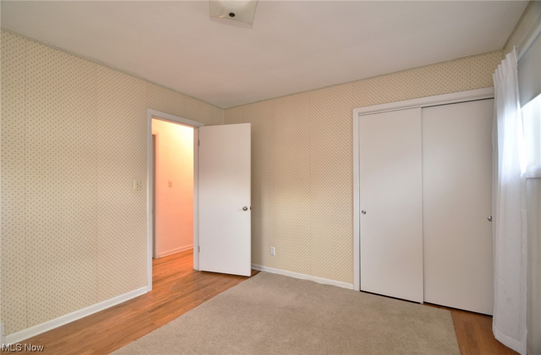 28740 Forest Road Willowick, OH 44095 - Photo 17 of 27 Unfurnished bedroom featuring light hardwood flooring and a closet
