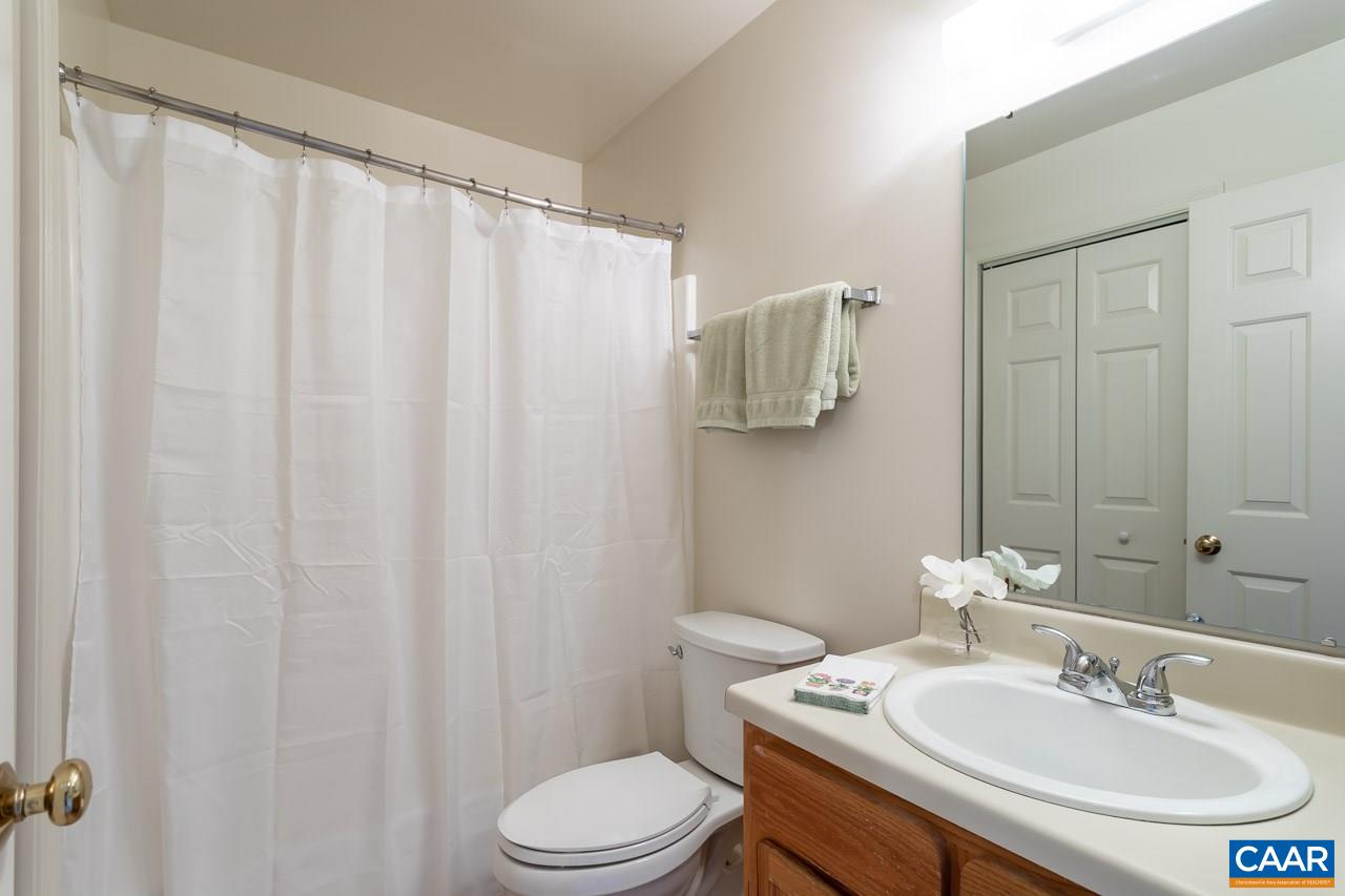 1509 Minor Ridge Court Charlottesville, VA 22901 - Photo 15 of 20 a bathroom with a sink a toilet and shower curtain