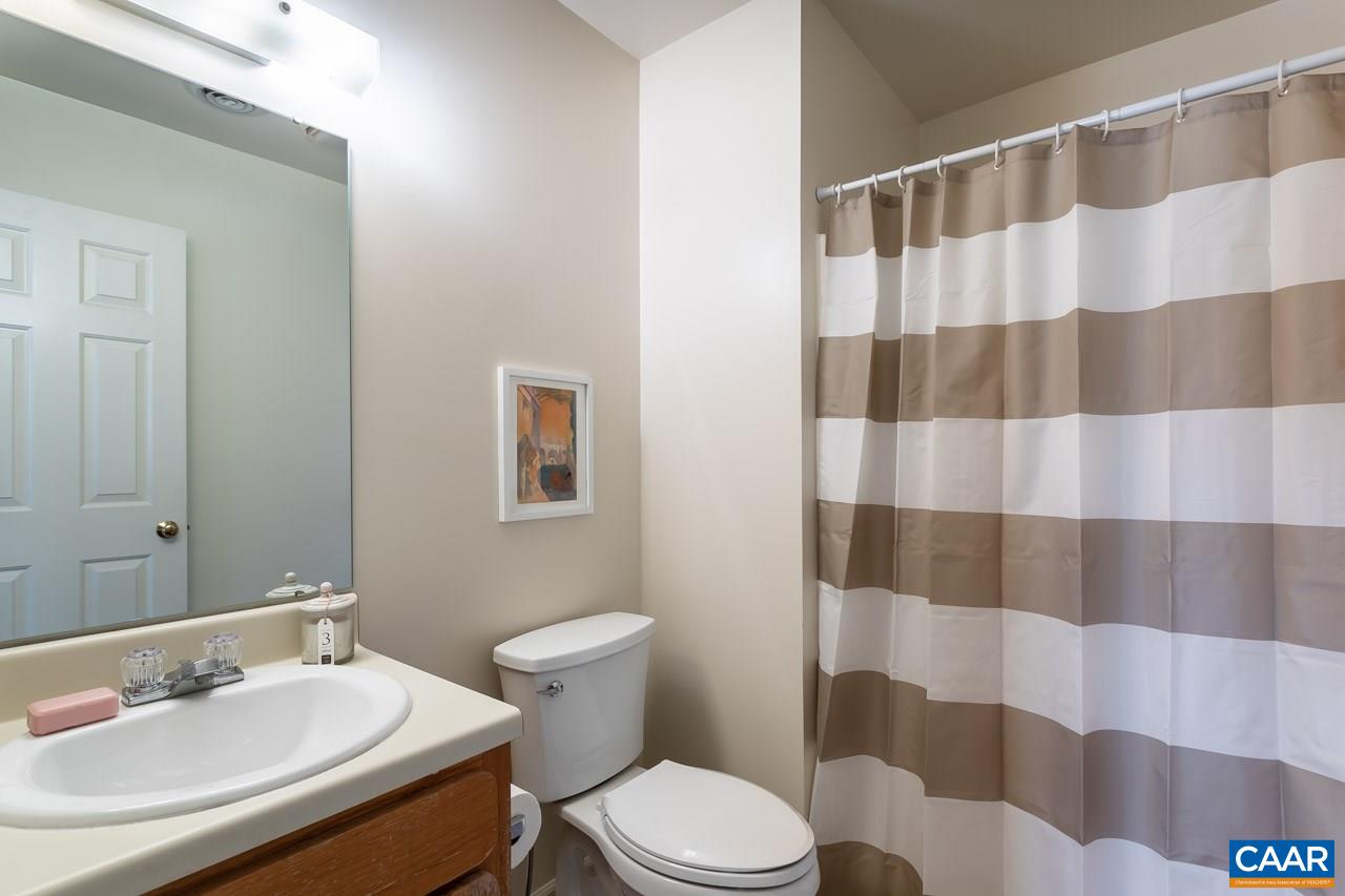 1509 Minor Ridge Court Charlottesville, VA 22901 - Photo 18 of 20 a bathroom with a sink a toilet a shower and a mirror