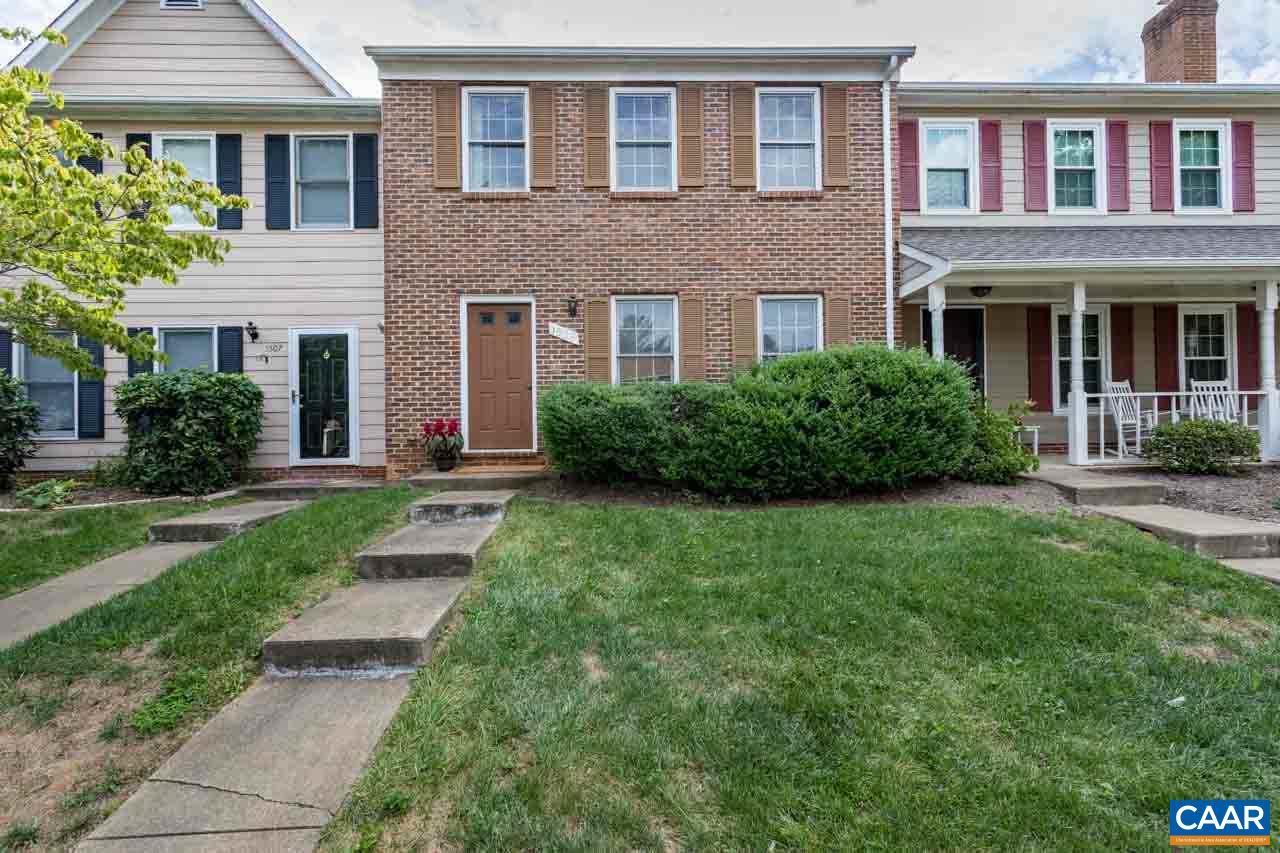1509 Minor Ridge Court Charlottesville, VA 22901 - Photo 2 of 20 a view of a brick house with a yard and plants