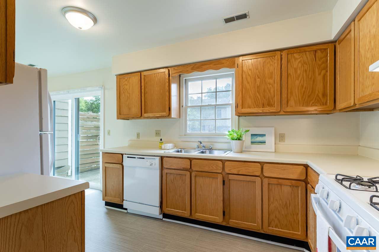 1509 Minor Ridge Court Charlottesville, VA 22901 - Photo 9 of 20 a kitchen with a sink stove and cabinets