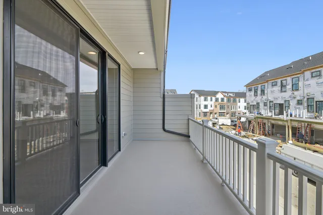 a view of front door of house with car parked