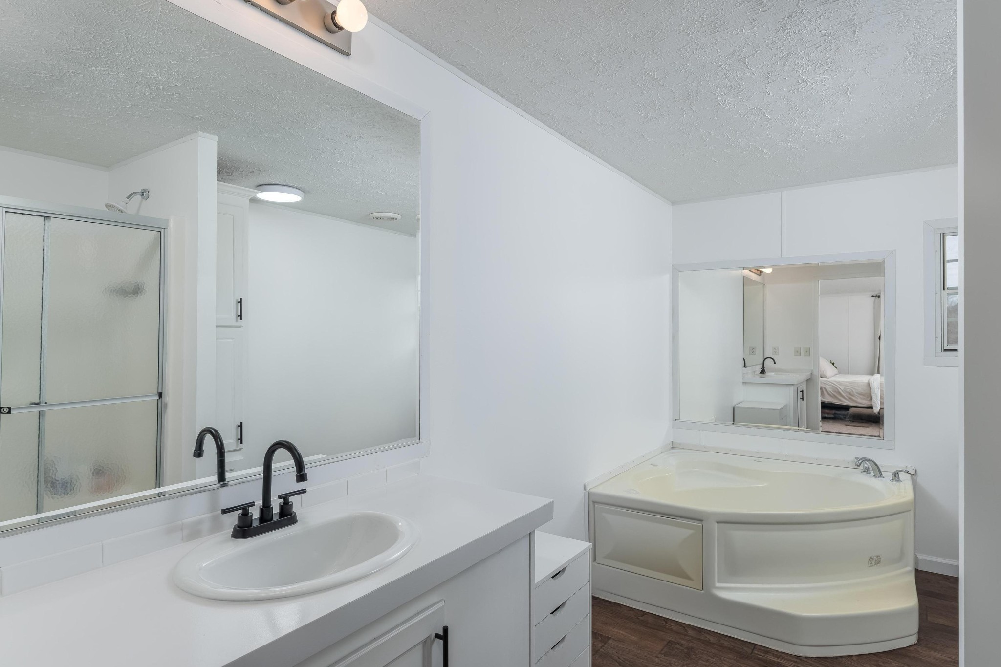720 Armstrong Road Southeast Cleveland, TN 37323 - Photo 9 of 16 a bathroom with a granite countertop sink a toilet and a mirror
