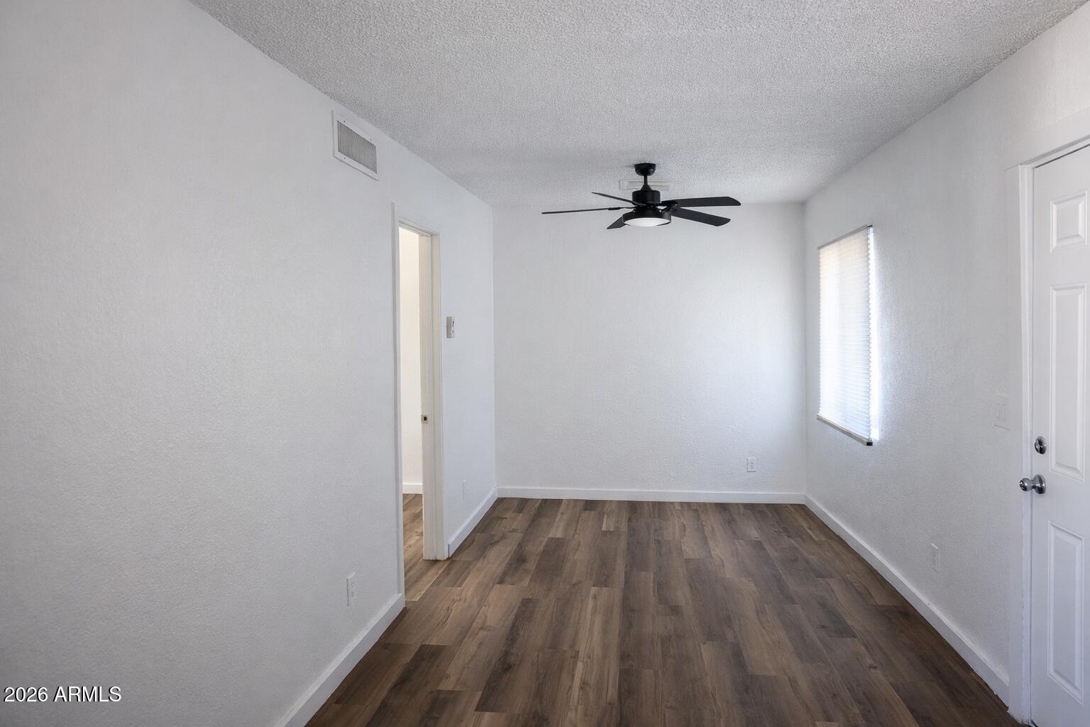 718 West Fillmore Street Phoenix, AZ 85007 - Photo 2 of 3 wooden floor in an empty room