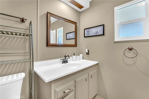 a bathroom with a sink toilet and vanity