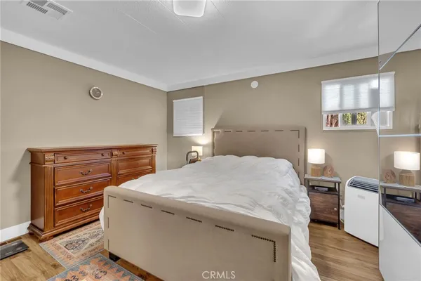 a bed room with a bed and a television