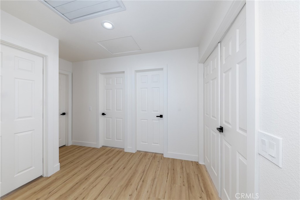 16322 Pick Place Riverside, CA 92504 - Photo 18 of 35 a view of a hallway with wooden floor