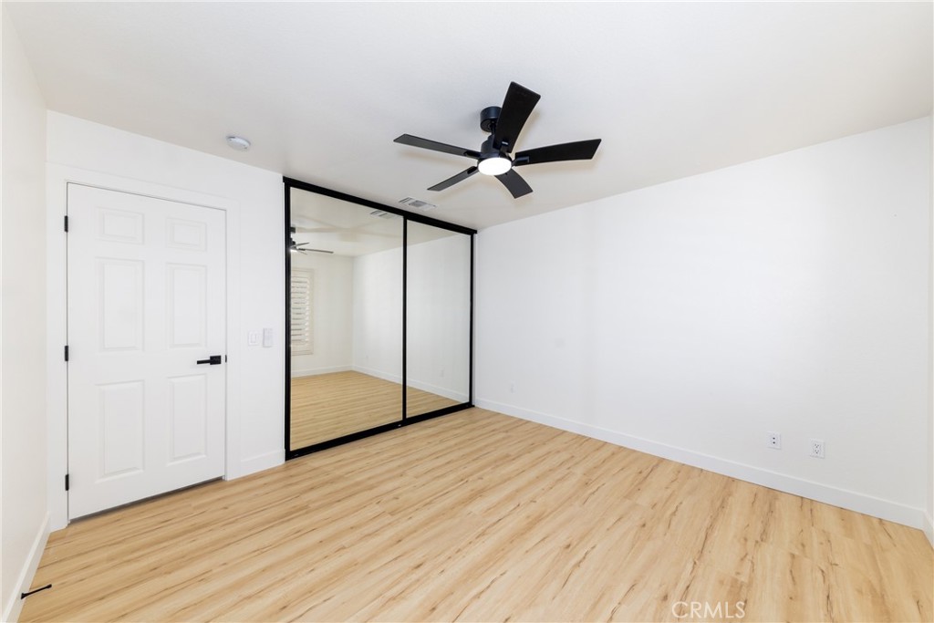 16322 Pick Place Riverside, CA 92504 - Photo 25 of 35 a view of empty room with wooden floor