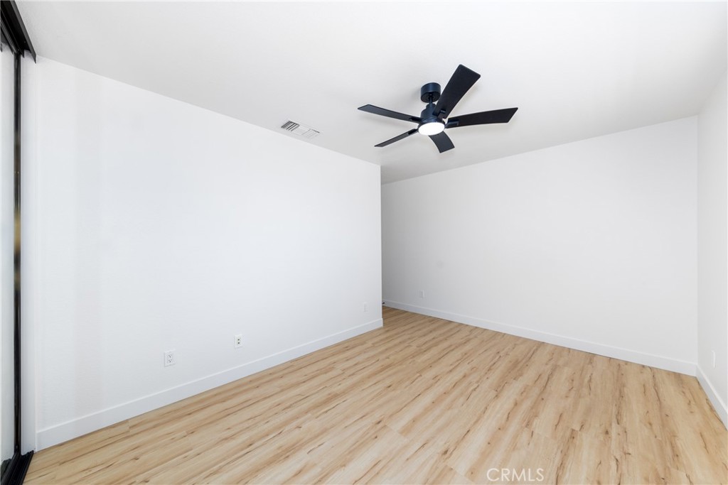 16322 Pick Place Riverside, CA 92504 - Photo 27 of 35 a view of a big room with wooden floor