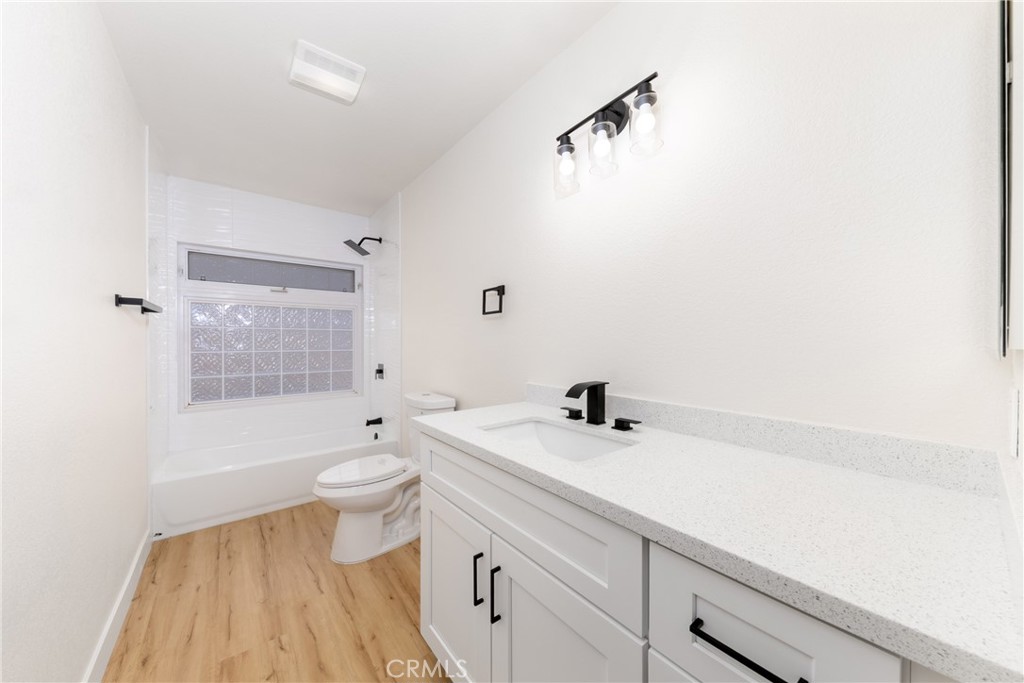 16322 Pick Place Riverside, CA 92504 - Photo 30 of 35 a bathroom with a sink a toilet and shower