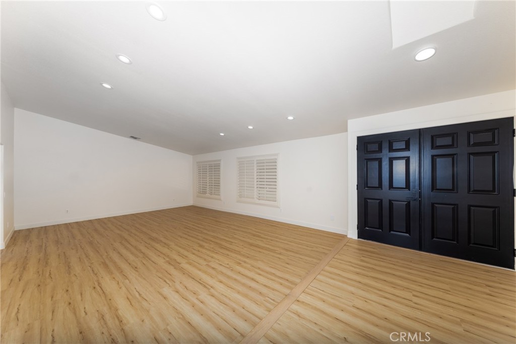 16322 Pick Place Riverside, CA 92504 - Photo 6 of 35 a view of empty room with wooden floor