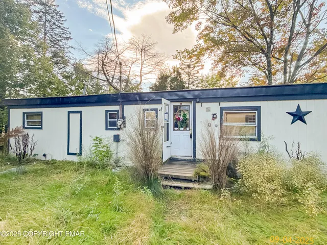 a front view of house with yard