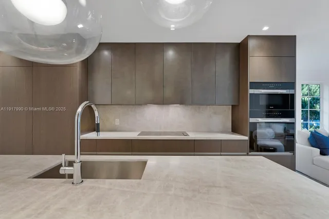 a living room with furniture a window and a potted plant