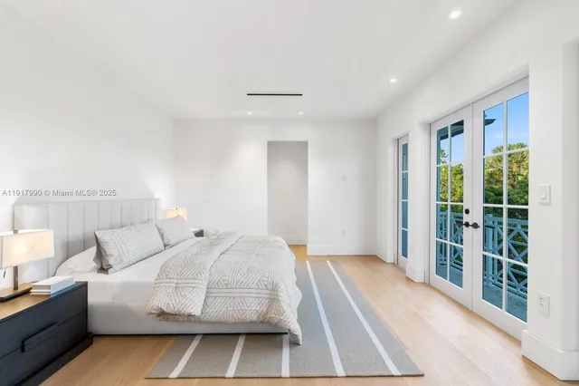 a white bath tub sitting in a bathroom and shower
