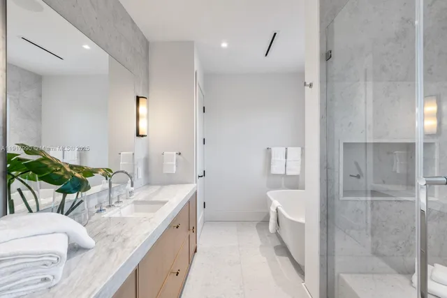 a front view of a house with a yard and a garden