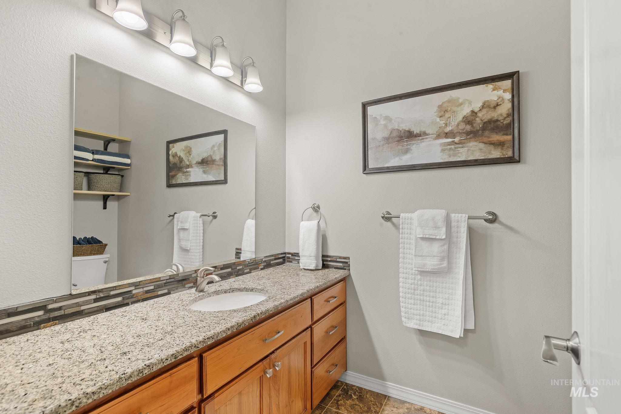 602 Quarry Road Asotin, WA 99402 - Photo 40 of 49 Carpeted room with a large window, neutral wall tones, white trim, and a white door