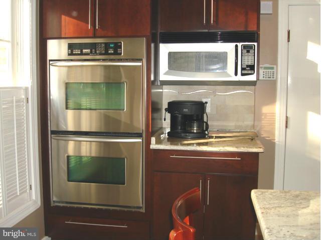 110 South River Landing Road, Unit 110 Edgewater, MD 21037 - Photo 12 of 30 a kitchen with a stove and a microwave