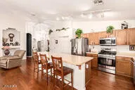 a large kitchen with a table and chairs