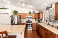 a bed room with a bed and a chair