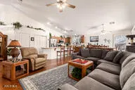 a living room with furniture and a chandelier
