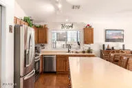 a large white kitchen with a large window