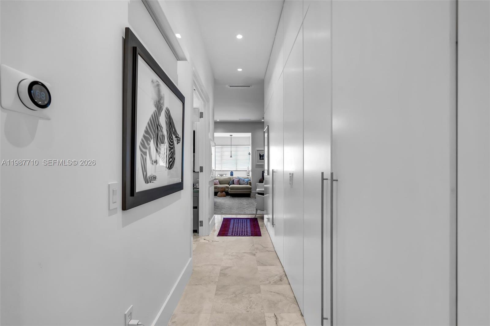 140 Hampton Lane Key Biscayne, FL 33149 - Photo 13 of 43 a view of a hallway with wooden floor
