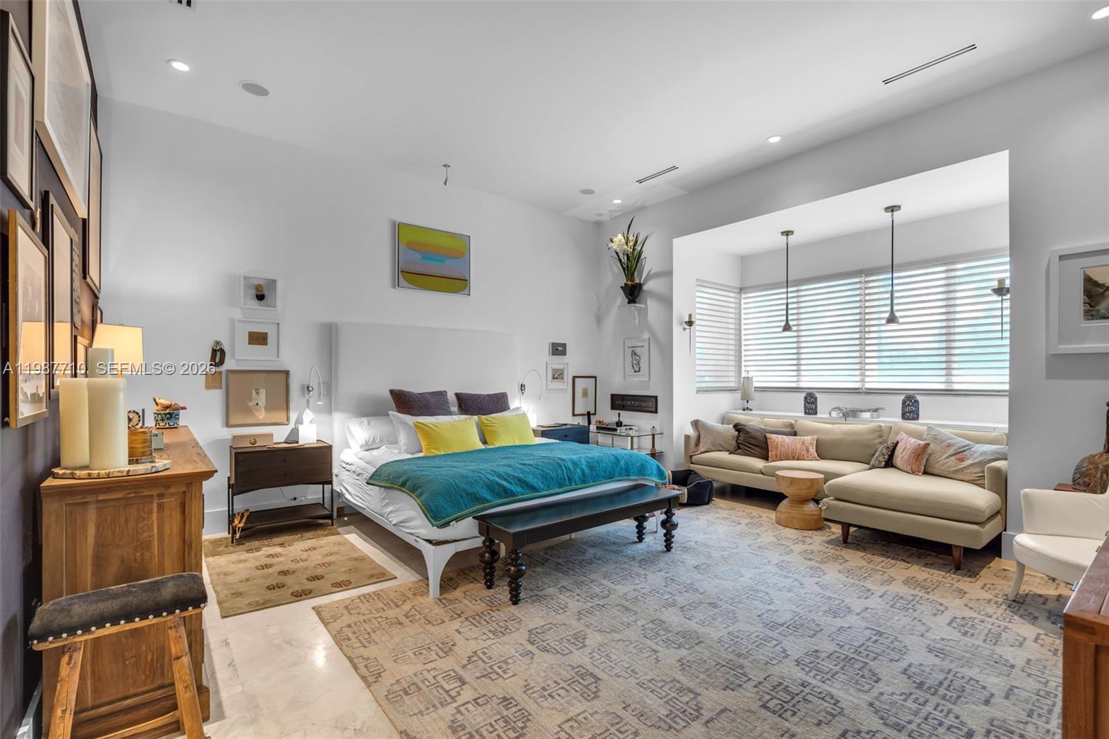 140 Hampton Lane Key Biscayne, FL 33149 - Photo 13 of 44 The primary bedroom is exceptionally comfortable and spacious, providing ample room to accommodate a sitting area.