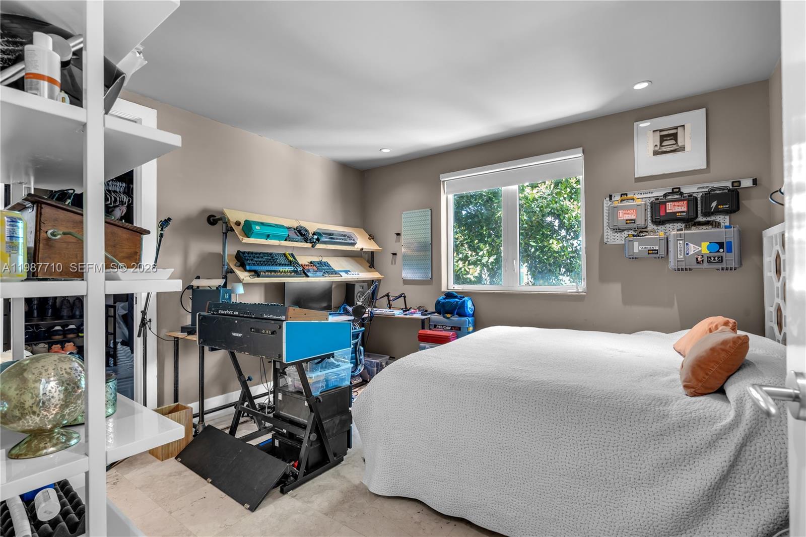 140 Hampton Lane Key Biscayne, FL 33149 - Photo 22 of 43 a bedroom with furniture and a window