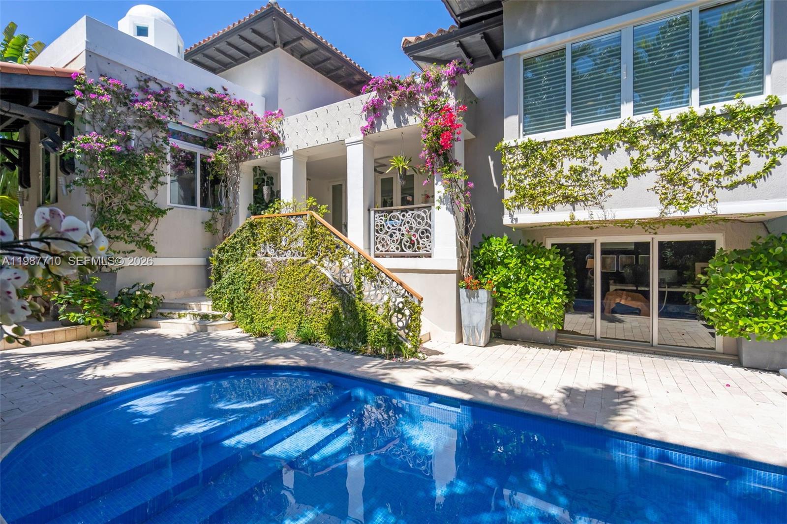 140 Hampton Lane Key Biscayne, FL 33149 - Photo 26 of 44 Pool with refurbished title and newly grouted.