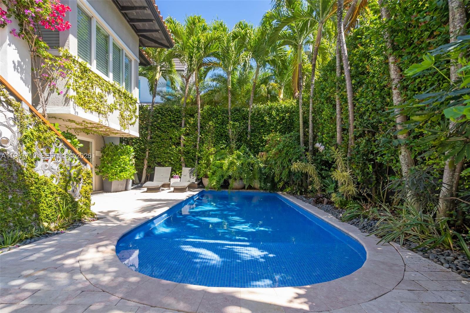 140 Hampton Lane Key Biscayne, FL 33149 - Photo 29 of 43 a view of a swimming pool with an outdoor space