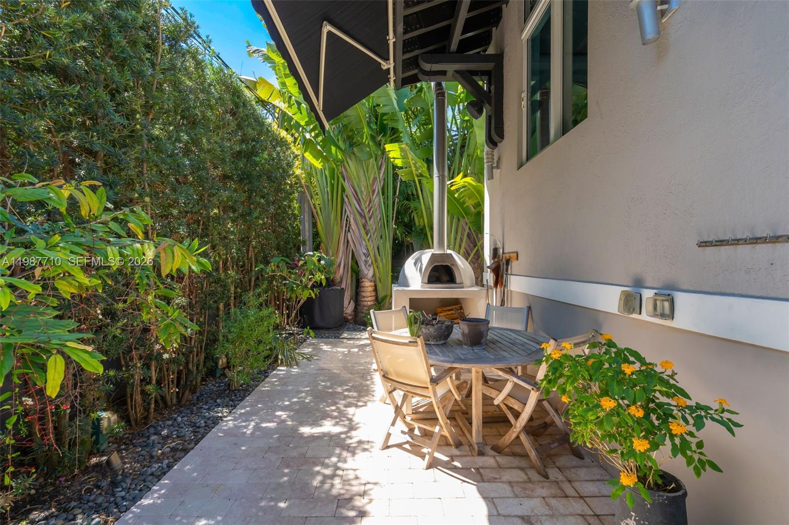 140 Hampton Lane Key Biscayne, FL 33149 - Photo 34 of 44 Pizza oven with wood and all tools.